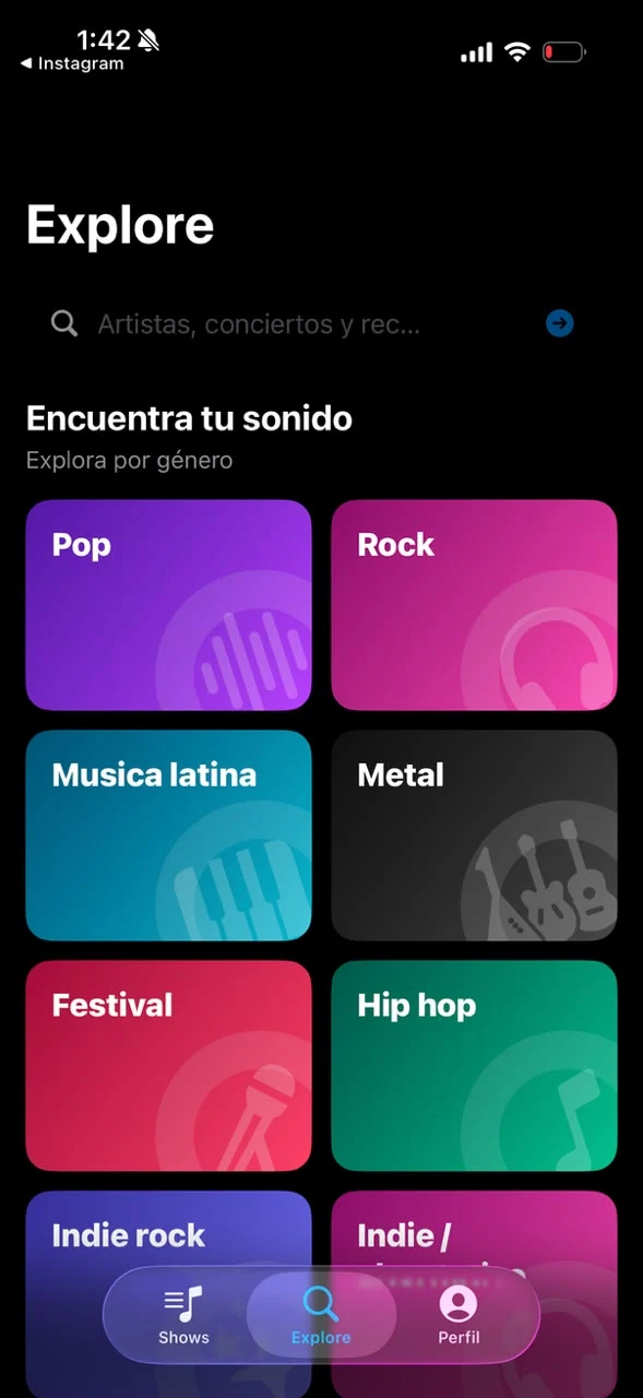 Pantalla Explore de Showkit con géneros como pop, rock, música latina, metal e indie.